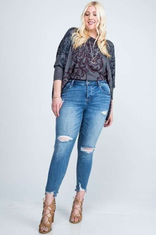 DISTRESSED MID RISE SKINNY WITH DISTRESSED HEM