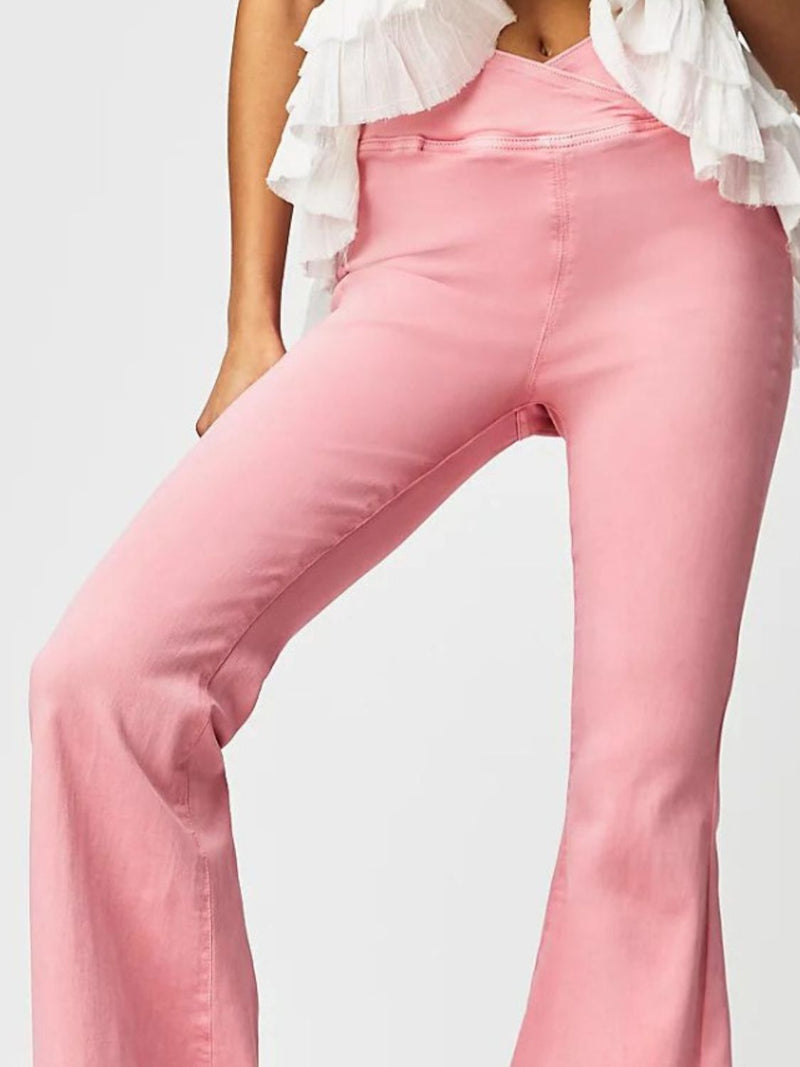 Close up view of pink Asymmetric Waist Flare Jeans