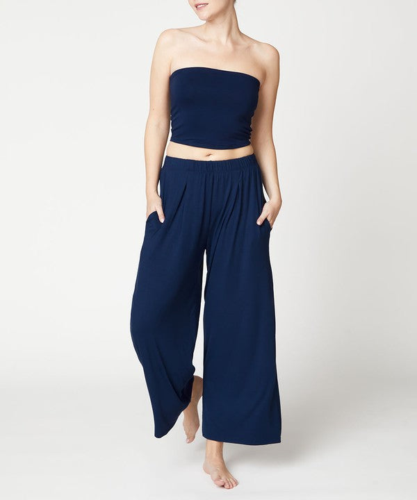 Model showing pockets of blue BAMBOO WIDE PANTS ANKLE LENGTH