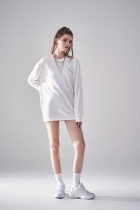 Model showing left side view of white Amoo Long Sleeve