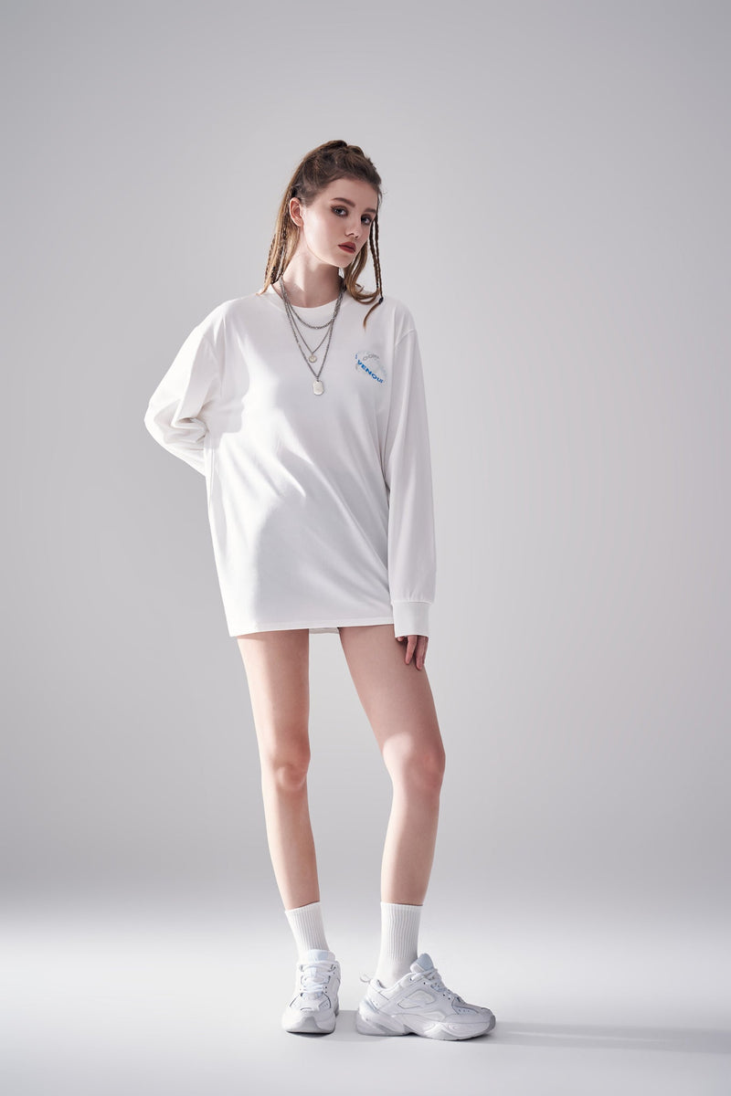 Model showing left side view of white Amoo Long Sleeve