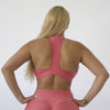 Woman showing back view of sports bra