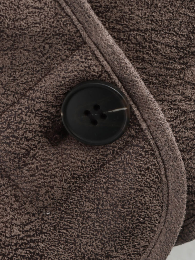 Close up view of button on the collar of Collared Neck Long Sleeve Plush Jacket