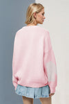 Back view of pink Basic Bae Contrast Letter Round Neck Long Sleeve Sweater