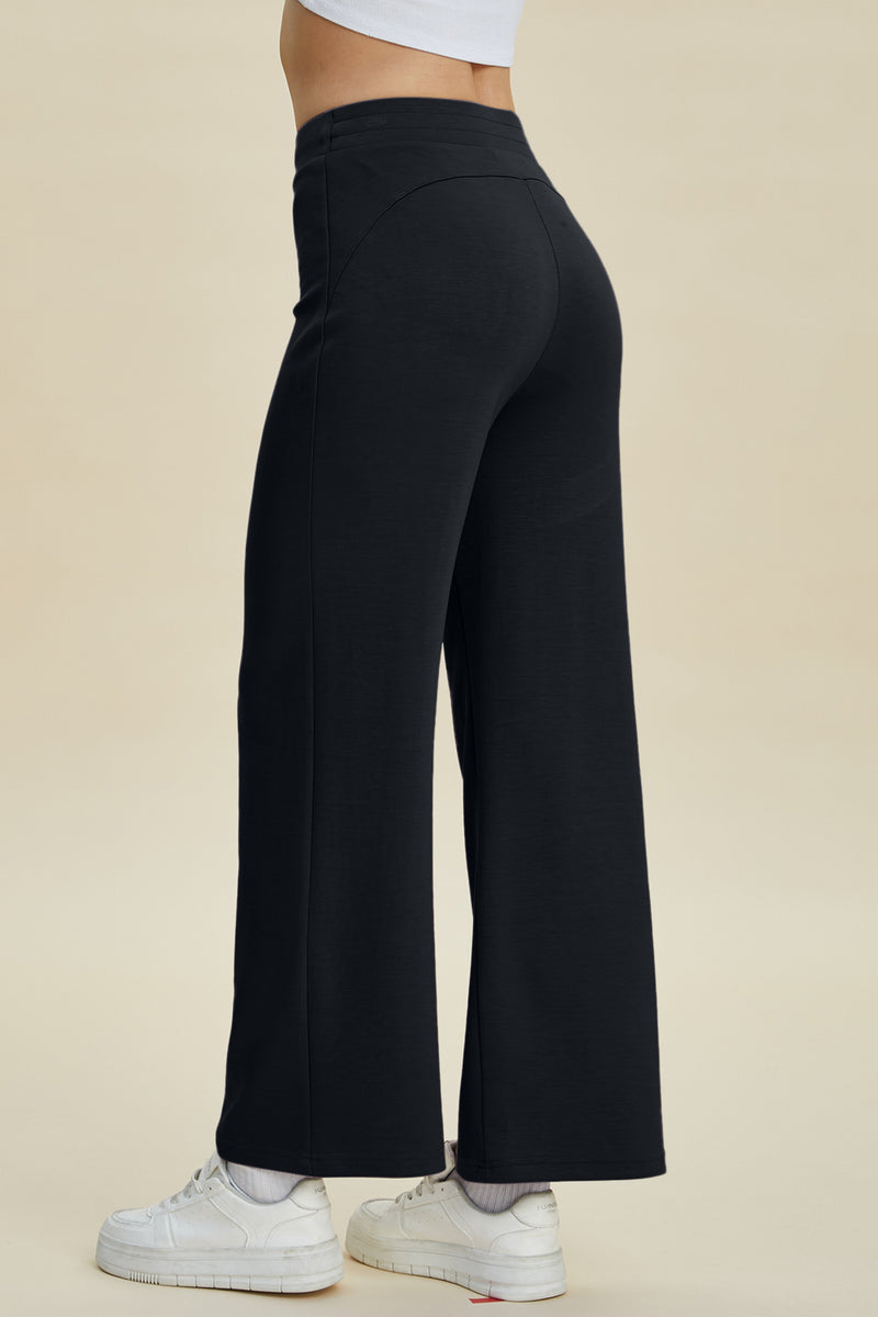 Back view of black Basic Bae Full Size Air Scuba Drawstring Wide Leg Pants