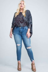 DISTRESSED MID RISE SKINNY WITH DISTRESSED HEM