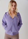 Model showing pockets on Bunny Crop Zip-up Hoodie