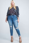 DISTRESSED MID RISE SKINNY WITH DISTRESSED HEM