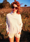 front view of woman outside in SWEATER TURTLENECK - KNIT PEARL beige