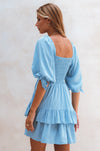 View of the back of Cha-Cha Ruffle Mini Dress -soft blue