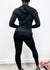 View of the back of Three-Piece Hooded Zip Jacket, Sports Bra, and High-Rise Leggings Set 