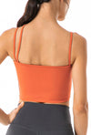 View of the back of Asymmetrical Cut-Out Strappy Longline Sports Bra Tank-orange