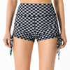 Front view of black checkered shorts