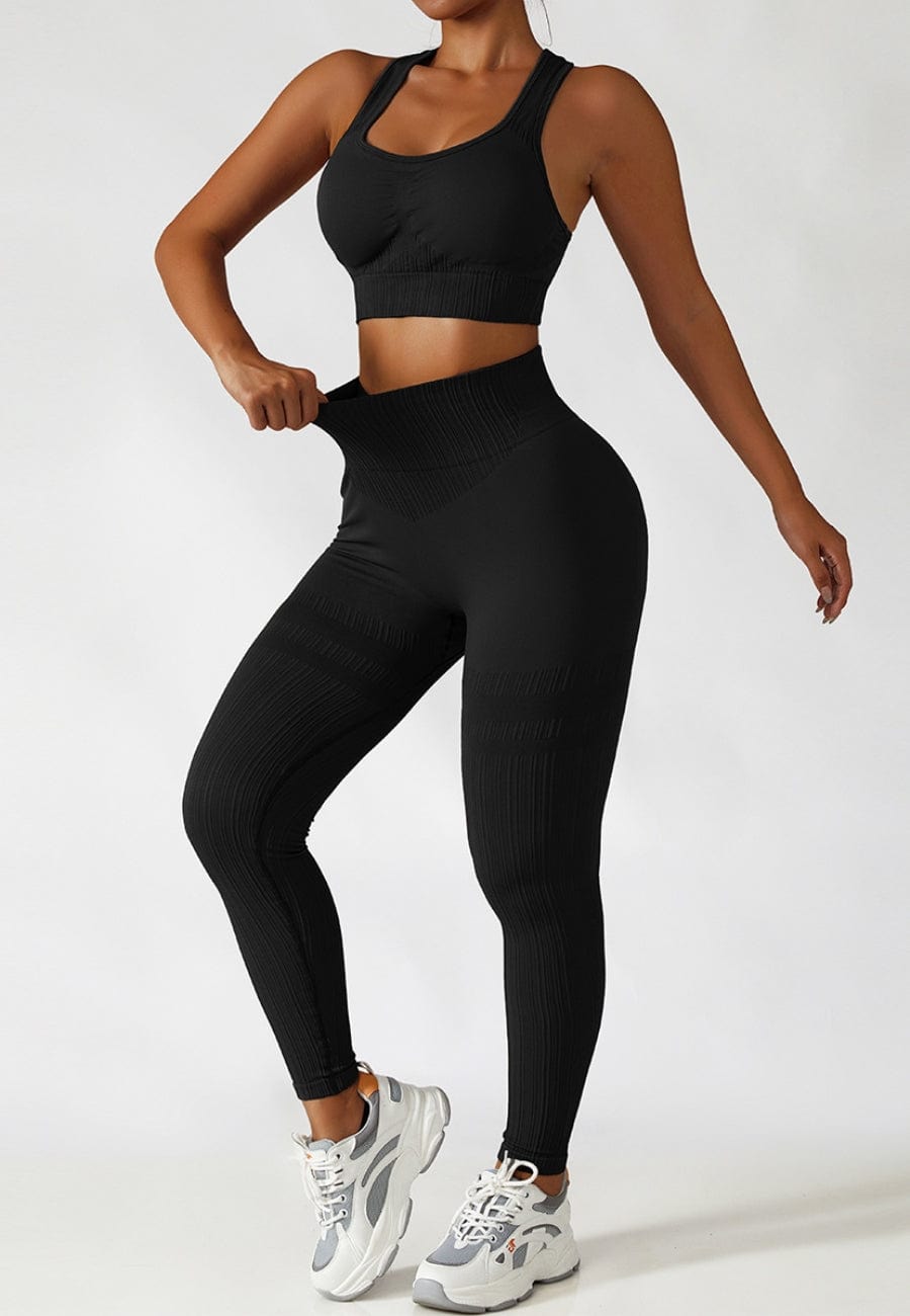 Model showing waist line of Racerback Sports Bra &amp; Sculpting High Waist Leggings Se