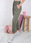 Model showing pockets on Drawstring Waist Pleated Detail Jogger