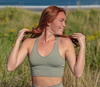 woman outside in a field wearing V Neck Bra Top green