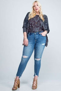 DISTRESSED MID RISE SKINNY WITH DISTRESSED HEM