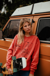 Girl leaning on a 60s van wearing Peanuts Joe Cool Snoopy Sweatshirt 