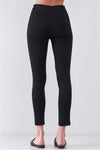 View of the back of Black Mid Rise Multi Stripe Side Trim Pants