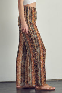 Zoom in view of left side of Elastic waisted palazzo pants in ethnic print