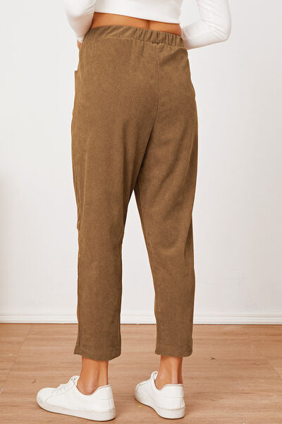 Model showing back of Pocketed Elastic Waist Pants-brown