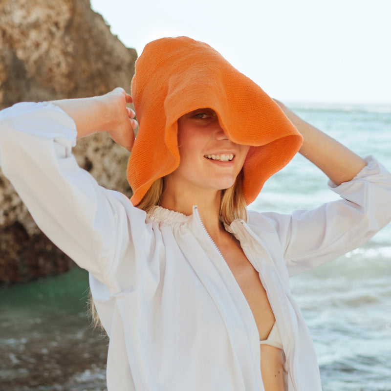 Close up view of Bloom Crochet Sun Hat, in Tangerine Orange 